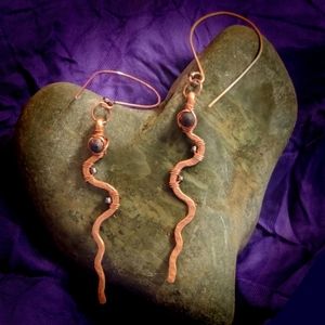 Handcrafted brushed copper earrings with iridescent blue glass beads